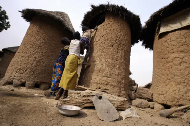 Children trying to get into a granary in Ivory Coast