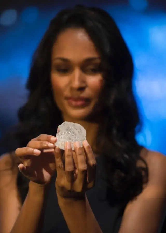 A model holds the 1,109-carat Lesedi La Rona diamond at Sotheby's in New York, the US