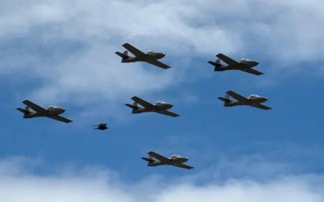 A flight of Air Force EMB 314 Super Tucano military light attack & counter insurgency (COIN) aircrafts overfly a parade during the celebrations for the independence of Colombia