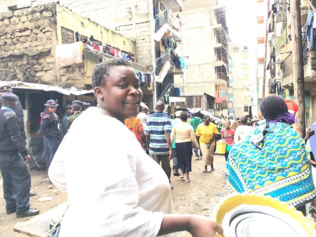 Woman carrying goods away