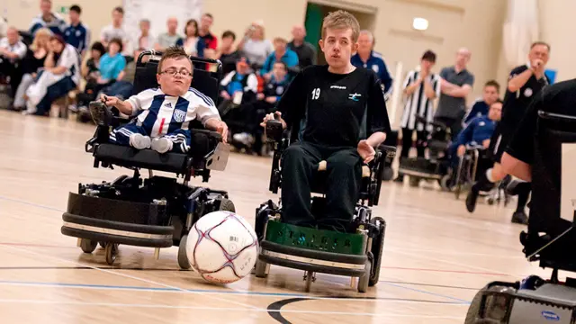 Duo playing Powerchair Football