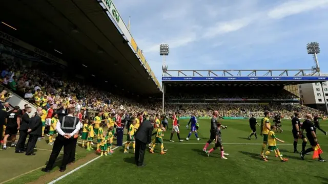 The two team walk out the tunnel