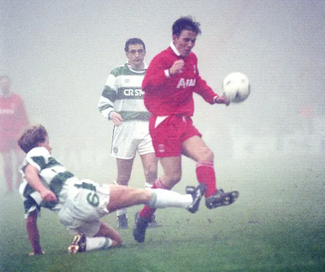 Mark McNally tackles Eoin Jess on a misty day at Celtic Park in 1994