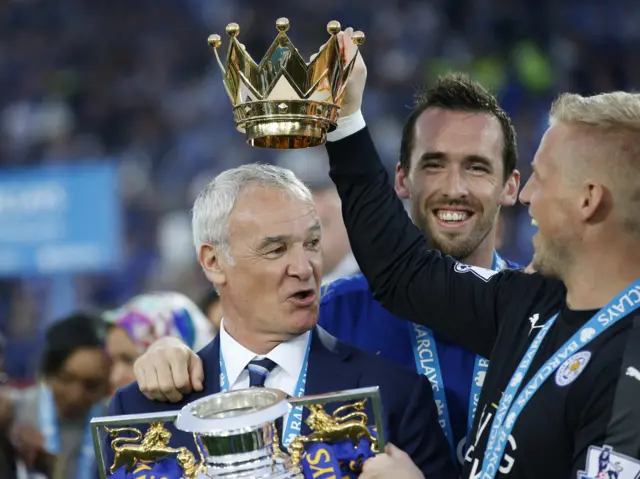 Claudio Ranieri celebrates with the Premier League trophy