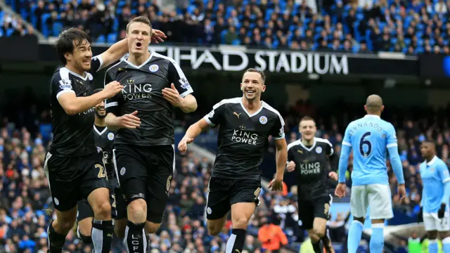 Leicester celebrate scoring at the Etihad