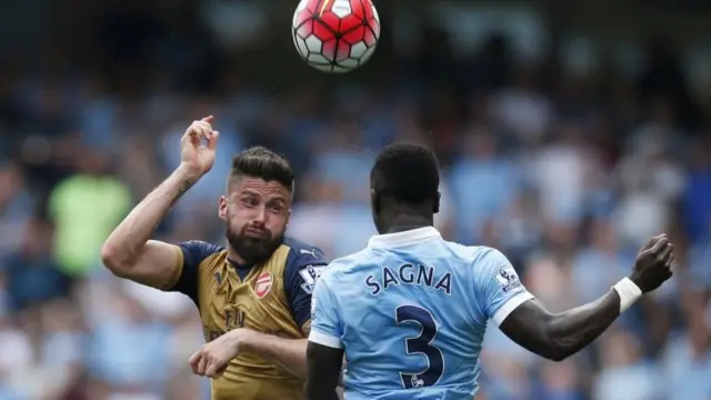 Olivier Giroud challenges for possession