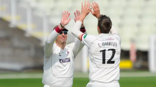 Craig Overton celebrates the wicket