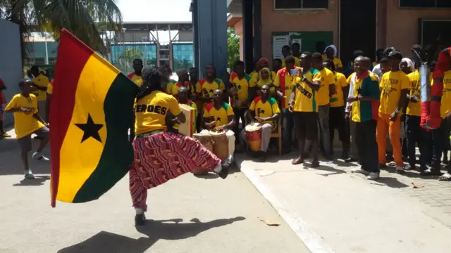 Fan waving Ghana flag