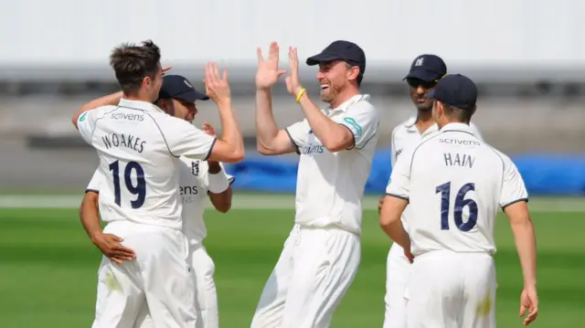 Chris Woakes celebrates a wicket