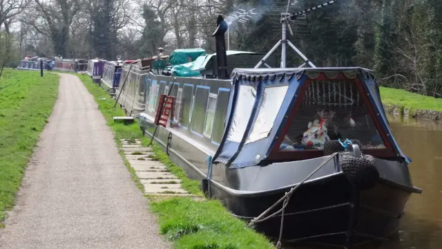 Narrowboats moored on the Shropshire Union Canal, adjacent to the Nantwich Riverside Loop path, in Nantwich