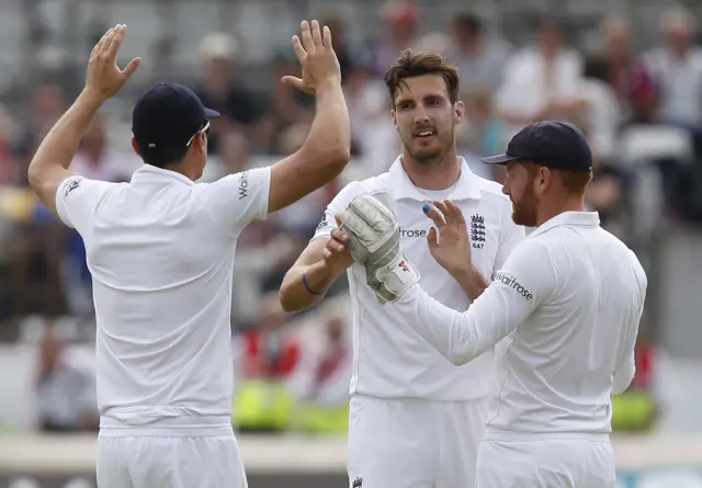 Steven Finn celebrates