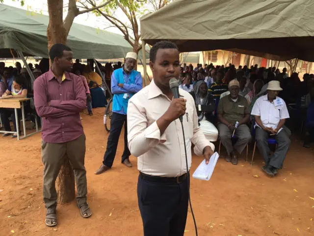 Man asking question at microphone