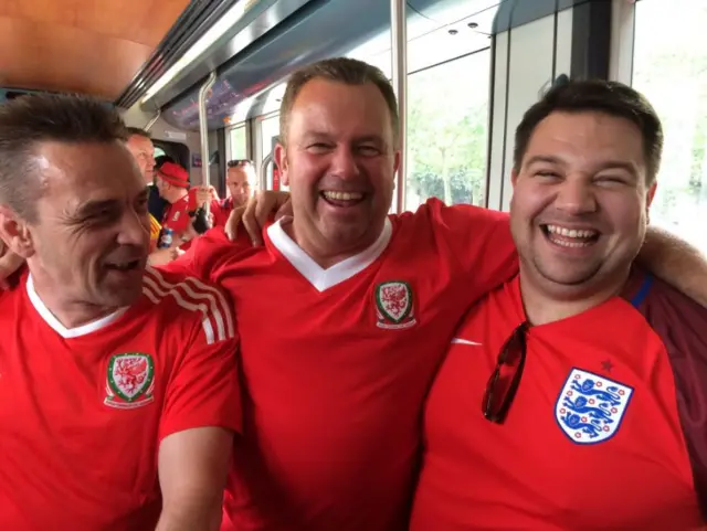 England and Wales fans arm in arm