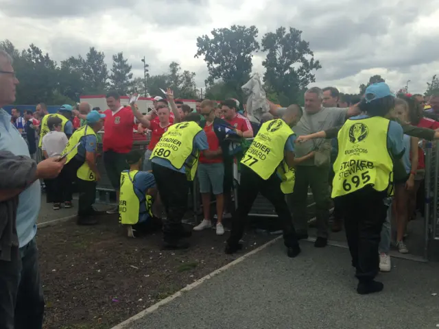 fans being searched at the stadium