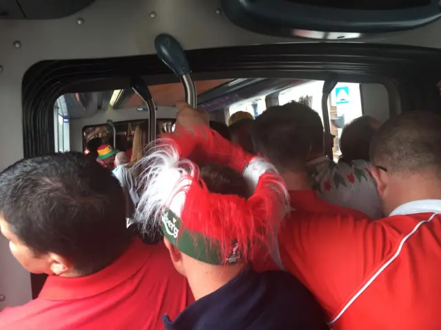 fans tightly packed on a tram in Bordeaux