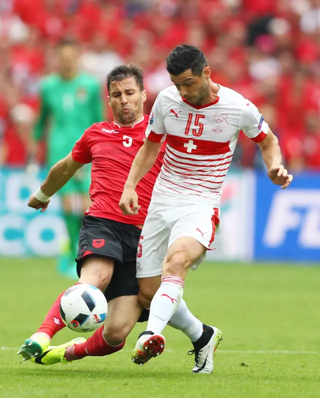 Lorik Cana fouls Blerim Dzemaili