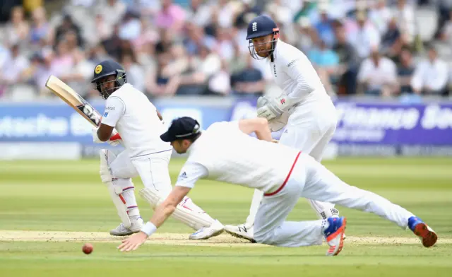 Rangana Herath of Sri Lanka hits past James Anderson