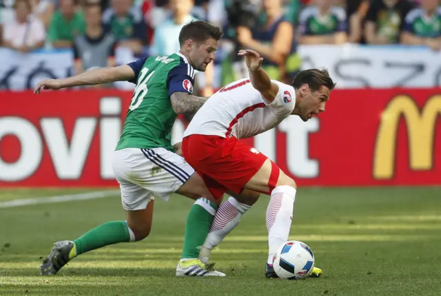 Oliver Norwood seeks to shut down Poland's Grzegorz Krychowiak