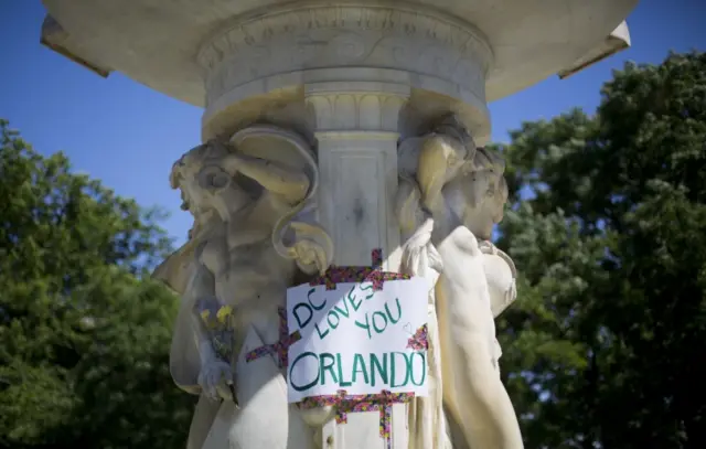 A sign is posted on the fountain at Dupont Circle in support of the victims of the massacre at a Orlando nightclub,