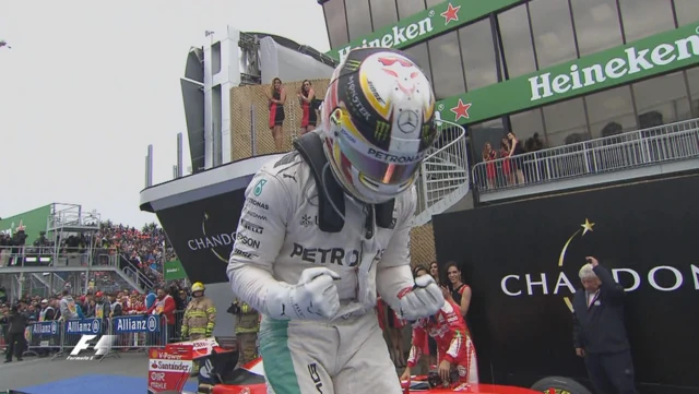 Lewis Hamilton jumps out of his car