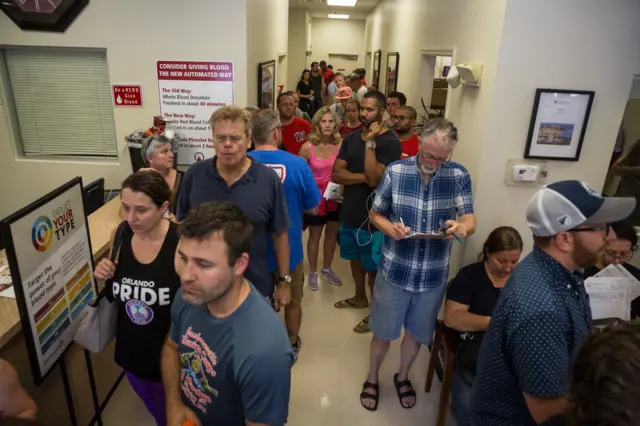 Donors line up outside OneBlood Blood Donation Center in Orlando, Fla., on Sunday, June 12, 2016.