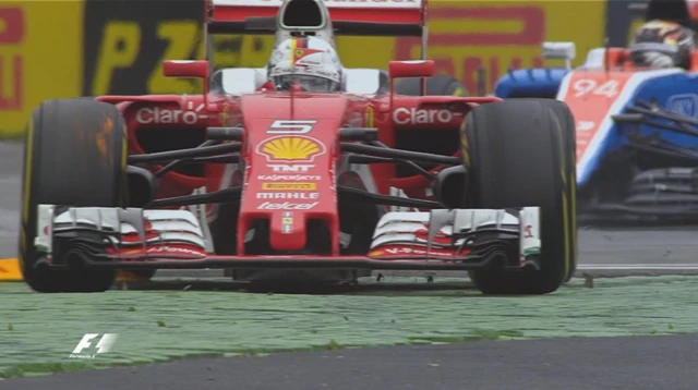 Sebastian Vettel runs over the final chicane