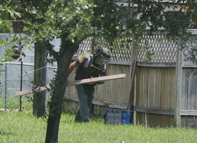 A Bomb Disposal Unit checks for explosives around the apartment building where shooting suspect Omar Mateen is believed to have lived on June 12, 2016 in Fort Pierce, Florida