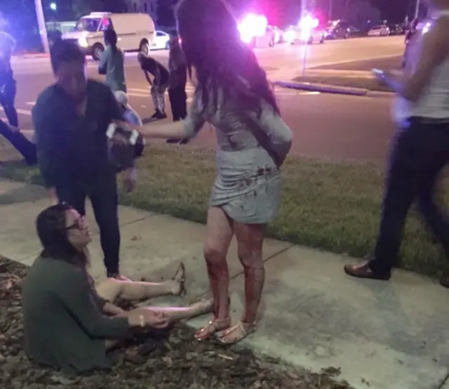 People gather after the shooting in Orlando