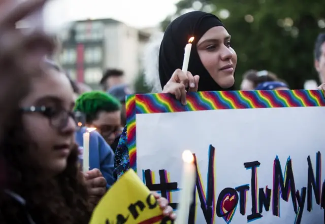 Muslim woman at a vigil in Seattle