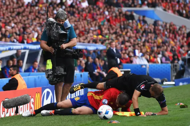 Alvaro Morata tackles linesman