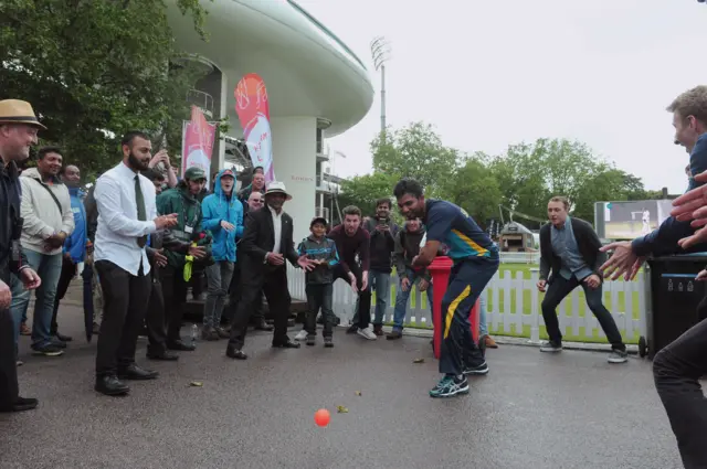 Dasun Shanaka joins fans in a game of cricket as rain stops play