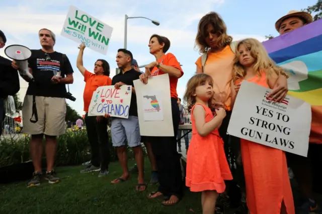 People at a vigil in West Hollywood, California (12 June 2016)