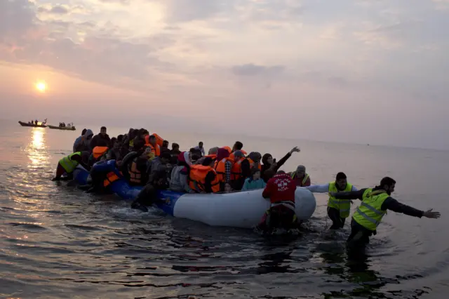 Migrants are pulled from the sea