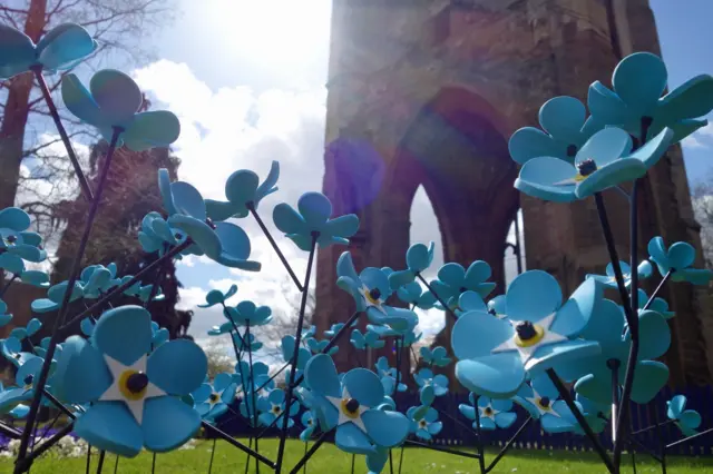 Forget-me-nots by St Andrew's spire