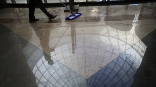 Person cleaning the floor