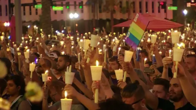 People in Orlando hold a vigil for the victims