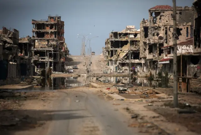 This Oct. 22, 2011 file photo, shows a general view of buildings ravaged by fighting in Sirte, Libya