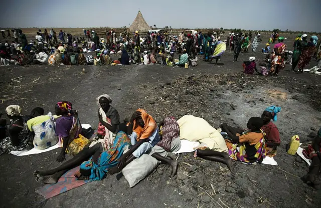 A large number of people wait for food air-drops by ICRC (International Committee of the Red Cross), outside Thonyor, in South Sudan, on February 3, 2016.