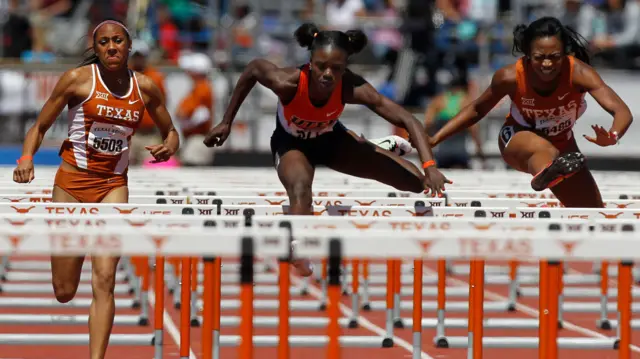 Texas" Ashley Miller (5503), UTEP"s Tobi Amusan, center, and Texas" Mobolaji Adeokun, right, compete in the women"s 100-meter hurdles during the Texas Relays, Saturday, April 2, 2016, in Austin, Texas.