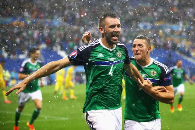 Gareth McAuley celebrates