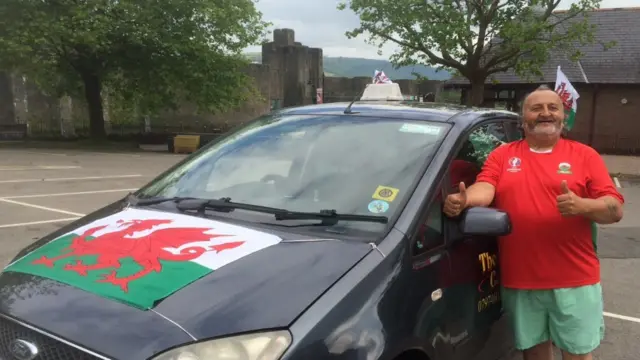 Wales fan with decorated taxi