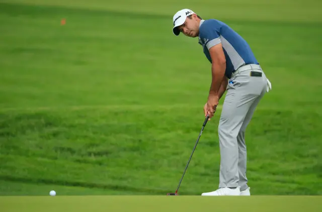 Jason Day putts on his second round