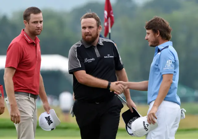 Shane Lowry and Emiliano Grillo shake hands