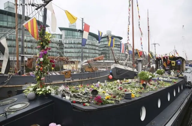 Tributes to Labour Party MP Jo Cox are placed on her houseboat in Wapping in London