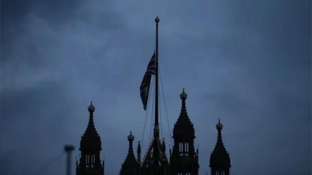 Union flag flying at half-mast over Parliament