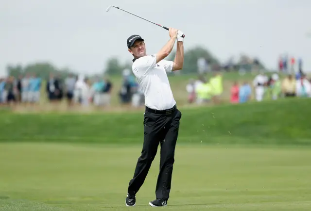 Justin Rose of England plays his third shot on the 12th