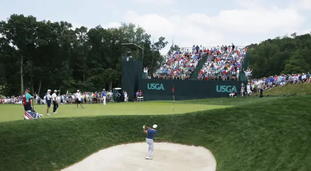 Jason Day hits out of a bunker