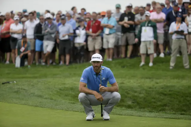 Dustin Johnson lines up his putt