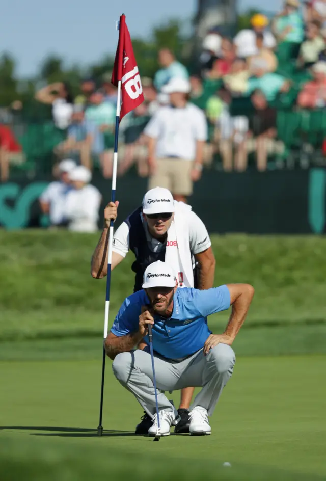 Dustin Johnson lines up a putt