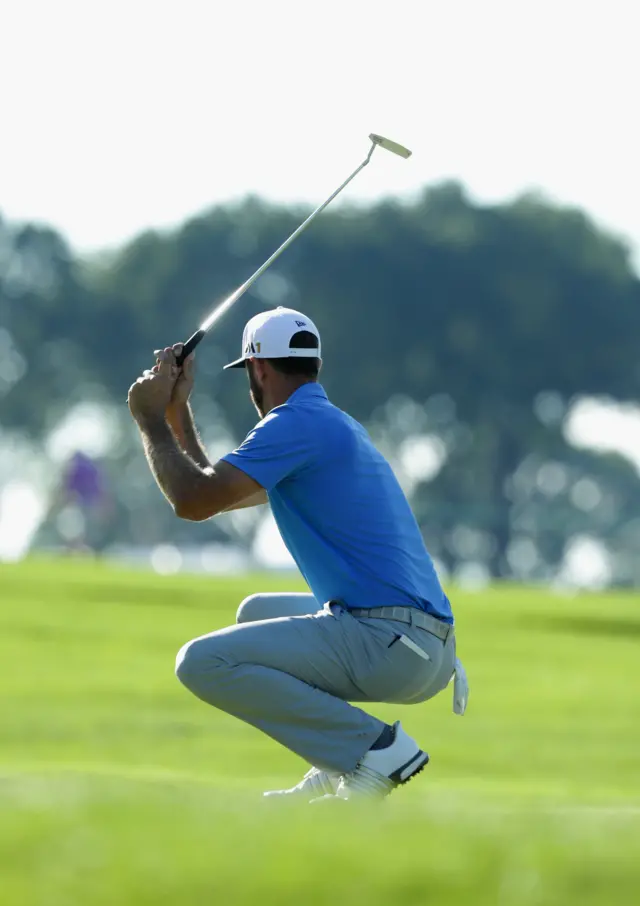 Dustin Johnson reacts to a missed putt